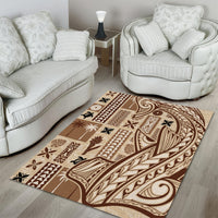 Rectangular beige and brown tapa area rug with ornate border, floral shapes, and scrollwork