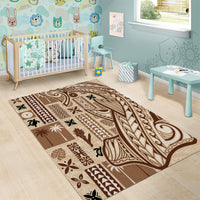 Beige and brown tapa patterned area rug with geometric bands, leaf details, and swirling lines