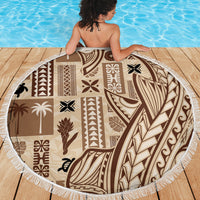 Round beach blanket with beige and brown tapa motifs, white fringe