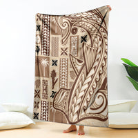 Beige tapa blanket with dark tribal pattern, large drape on a floor setup