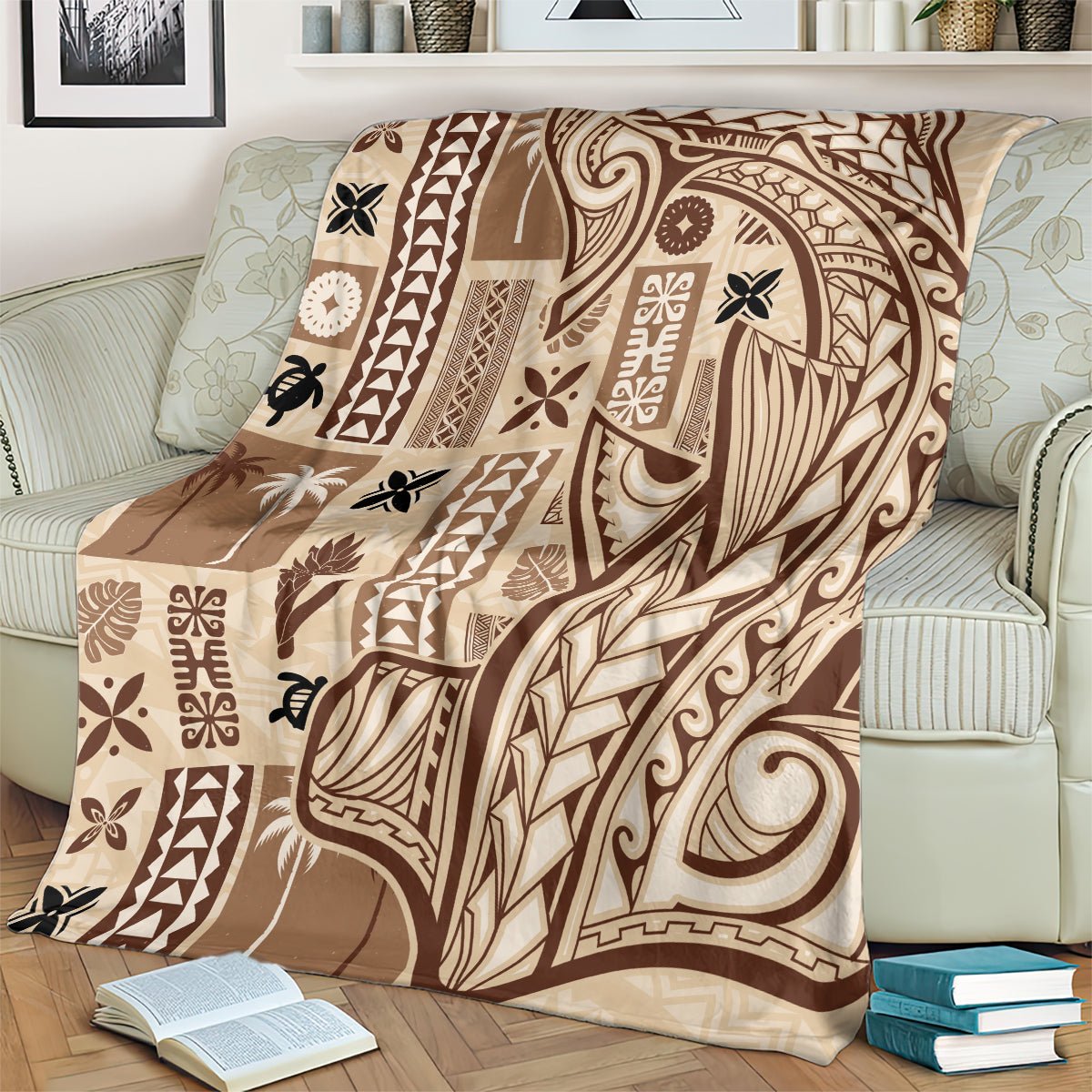 Beige tapa blanket with dark tribal pattern, draped over a light sofa
