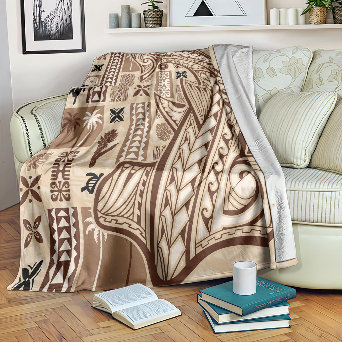 Beige tapa blanket with dark tribal pattern, laid across a striped couch