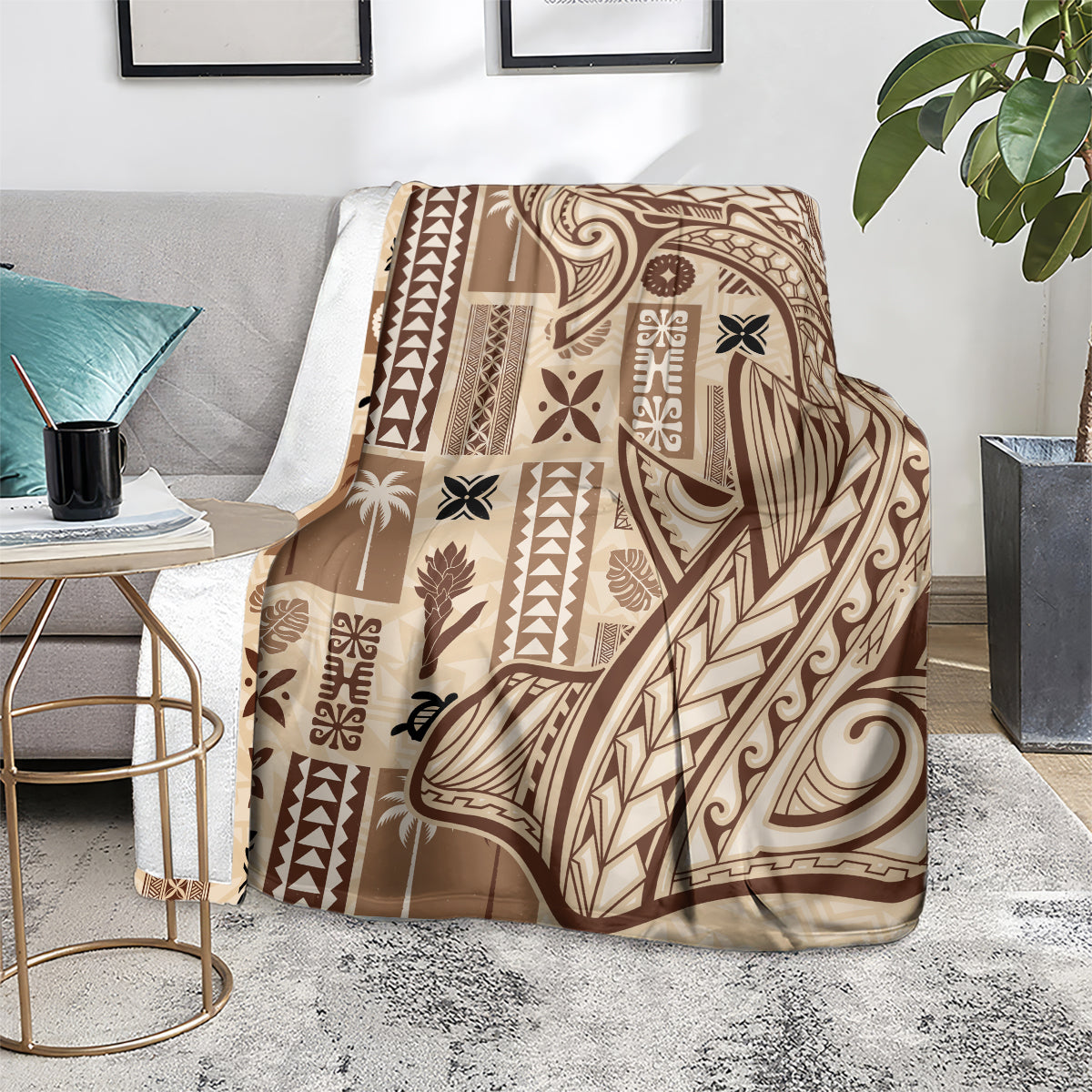 Beige tapa blanket with dark tribal pattern, draped over a chair