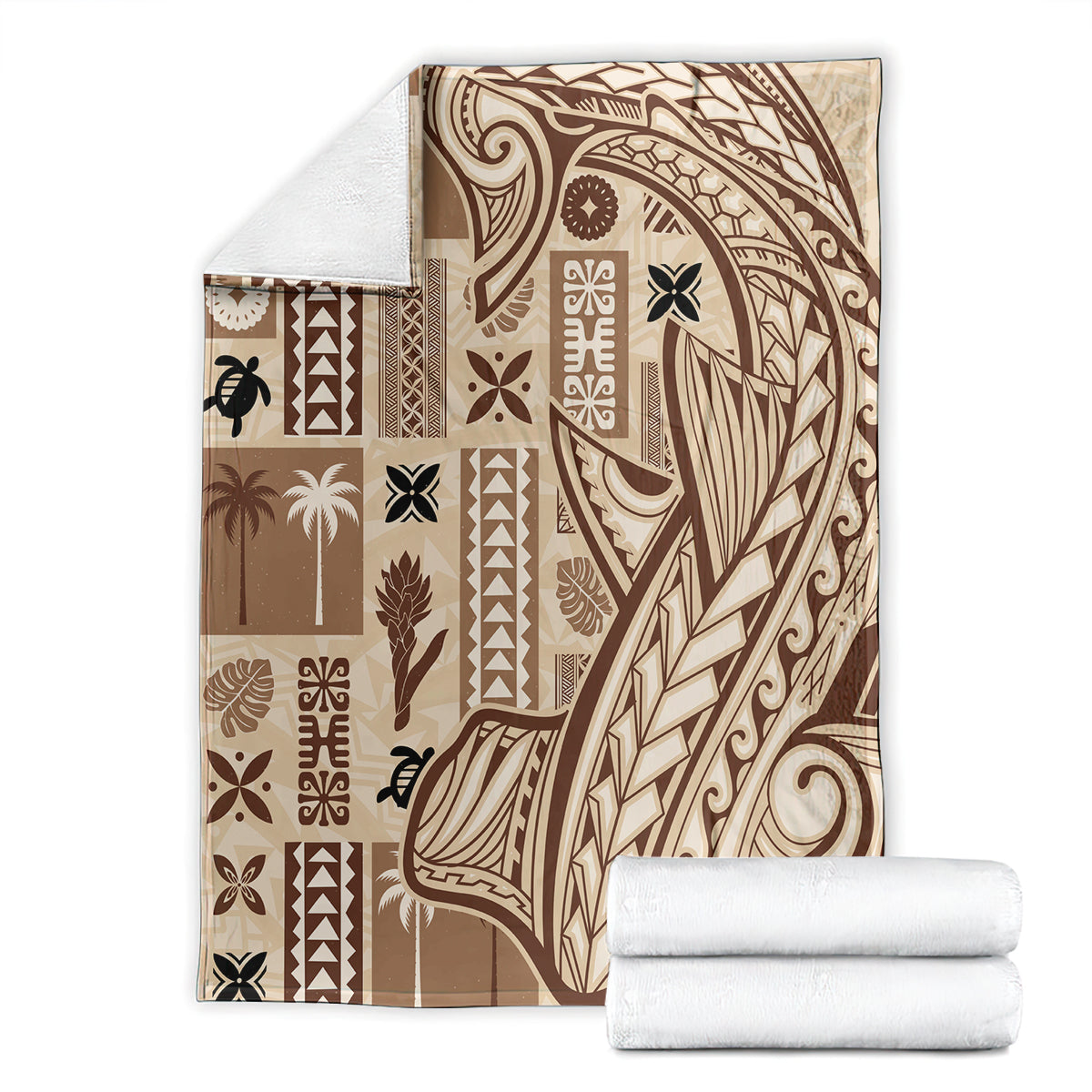 Beige tapa blanket with dark tribal pattern, folded beside rolled towels