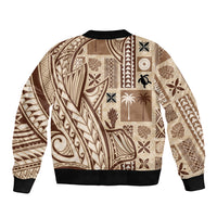 Beige bomber jacket back with tribal tapa patchwork pattern, ribbed hem and collar