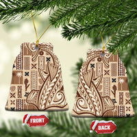 Beige ceramic Samoa tapa ornament with dark patterned design and gold hanging loop on pine.