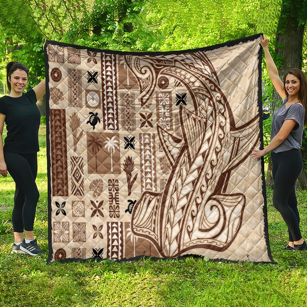 Beige quilt featuring large dark brown tatau face motif with patchwork panels, quilted.