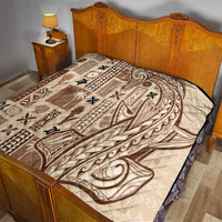 Beige and dark brown tapa quilt with swirling and star motifs, stitched quilted top.