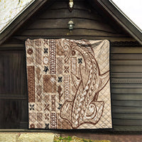 Beige quilted tapa siapo pattern with dark brown border and swirling center motif.