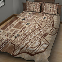 Beige tapa quilt on bed with two matching pillow shams, brown and black motifs