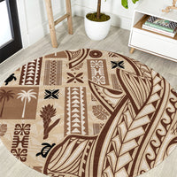 Round tapa-pattern carpet with brown and beige geometric motifs