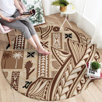 Round Polynesian tapa carpet with leaf, zigzag, and scroll motifs in brown/beige