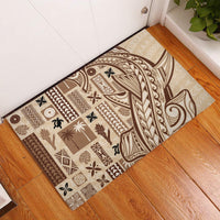 Beige brown patterned rubber doormat with Tapa-inspired motifs and leaf elements
