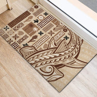 Large beige and dark brown patterned rubber doormat with tribal Tapa motifs