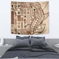 Beige tapa wall tapestry featuring brown geometric motifs and a stylized face/figure