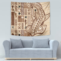 Beige tapa wall hanging with brown ornate curved linework and patchwork panels