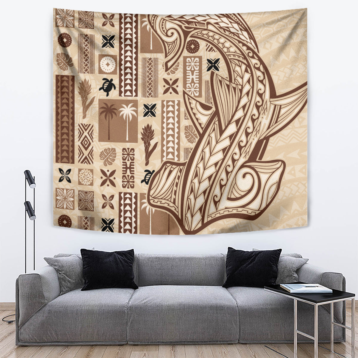 Beige tapa tapestry with dark-brown patterned borders and a large central figure