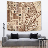Beige tapa tapestry with dark-brown patterned borders and a large central figure