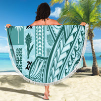 Teal round tapa beach blanket with fringe border and large geometric botanical print