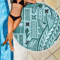 Teal round beach blanket with fringe edge and tapa pattern panel
