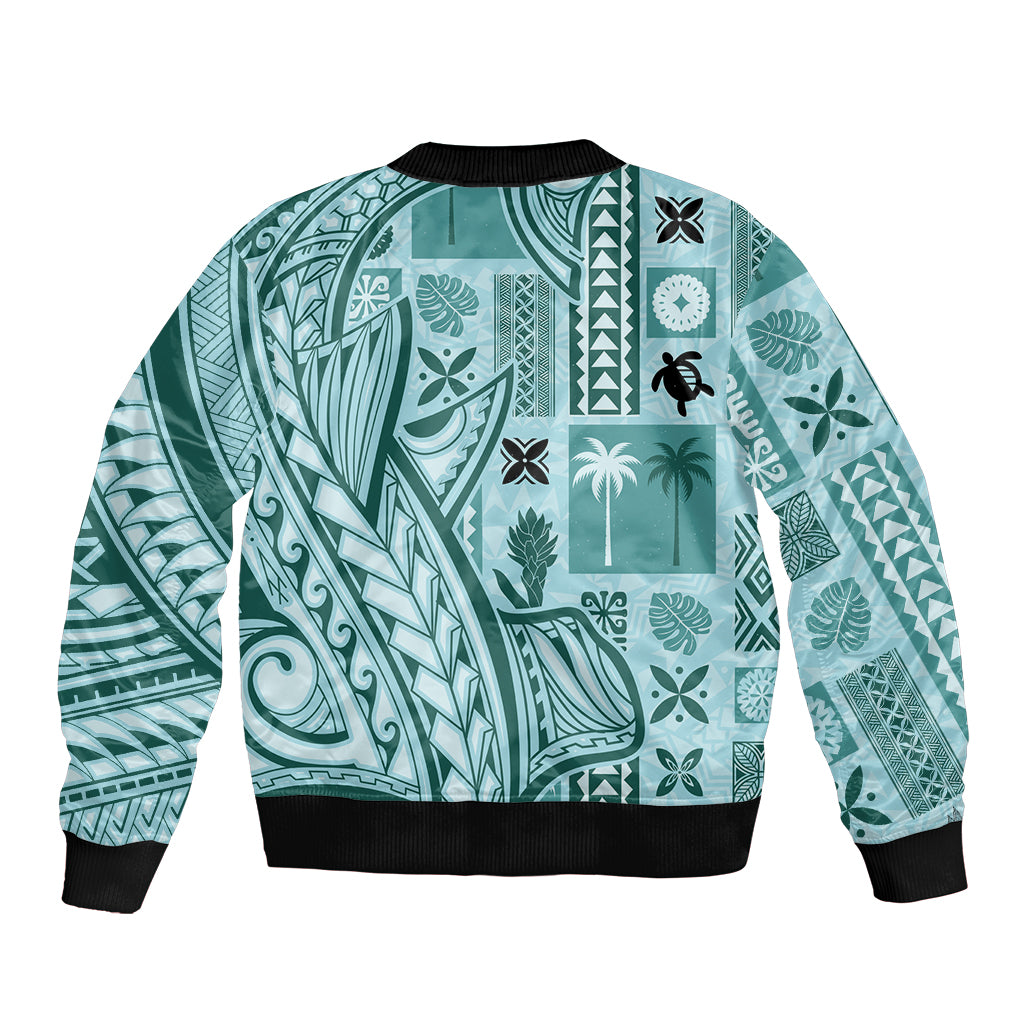 Unisex teal bomber jacket back view with ribbed black trim and intricate tiki tapa pattern