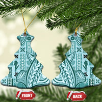 Teal heart-shaped ceramic ornament with tapa patterns, gold hanging loop