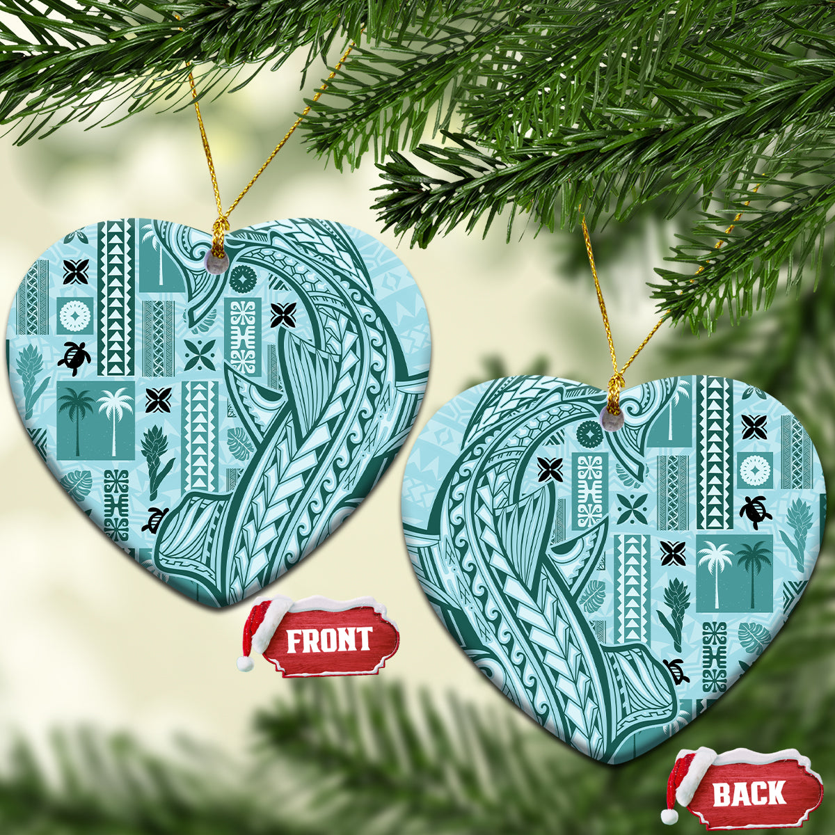 Teal heart-shaped ceramic ornament with tapa patterns, gold hanging loop on tree