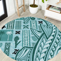 Round teal tapa-pattern carpet with floral, leaf, and geometric motifs