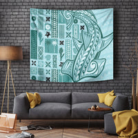 Teal tapa tapestry with bold Polynesian-style patterns and curved motif