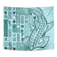 Teal tapa tapestry with dense patterned tiles and sweeping wave emblem