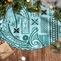 Teal patterned tree skirt with bold icon and geometric motifs, circular shape