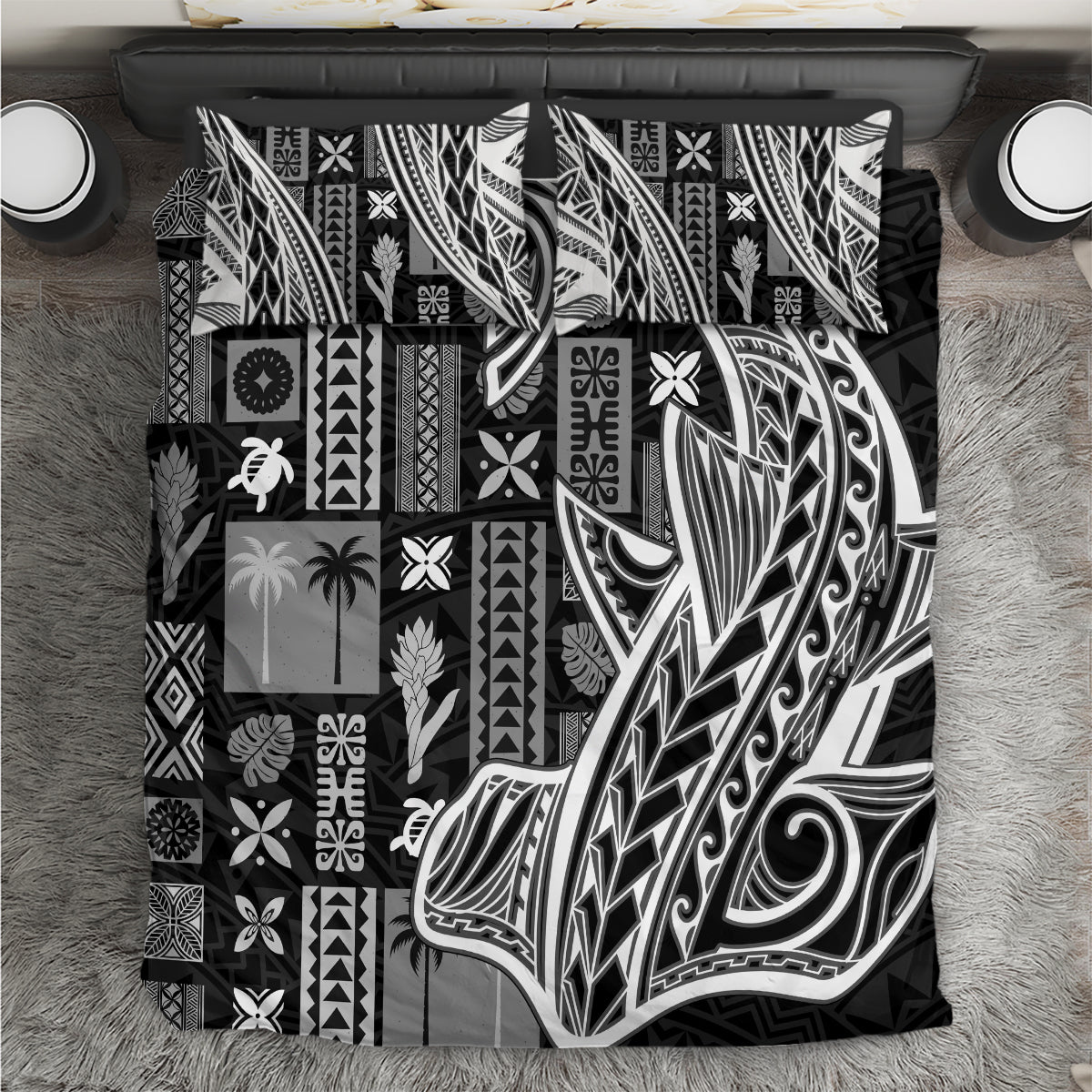Black and white tapa-pattern bedding set with geometric motifs on bed cover