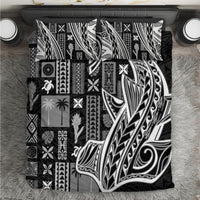 Black and white tapa-pattern bedding set with geometric motifs on bed cover