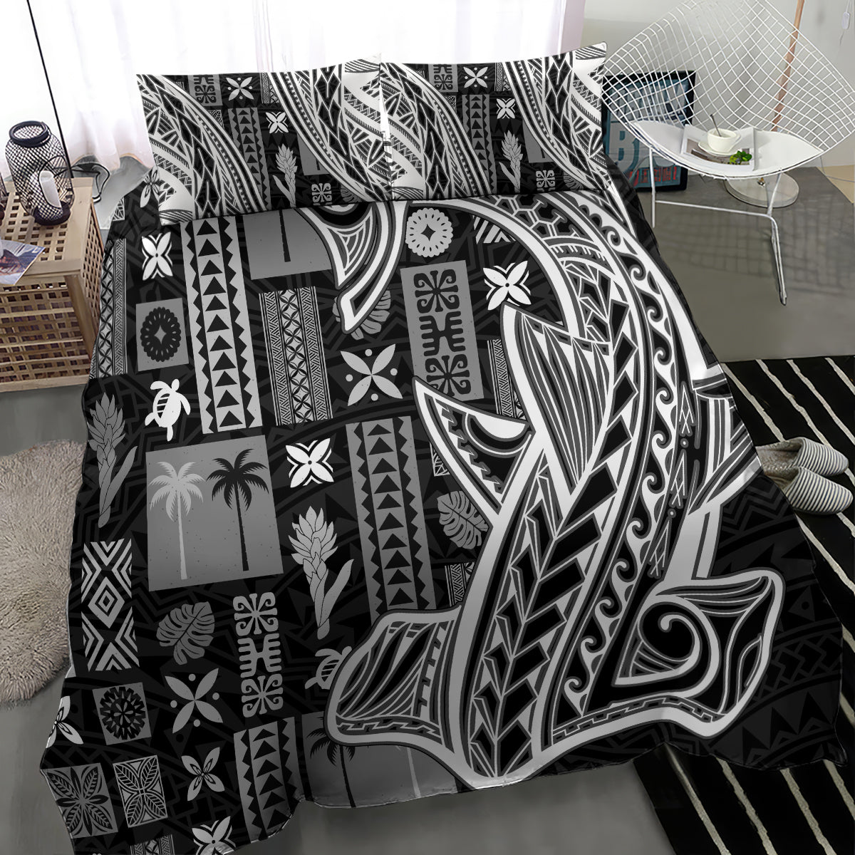 Black and white tapa-pattern bedding set with swirl and leaf motifs close-up