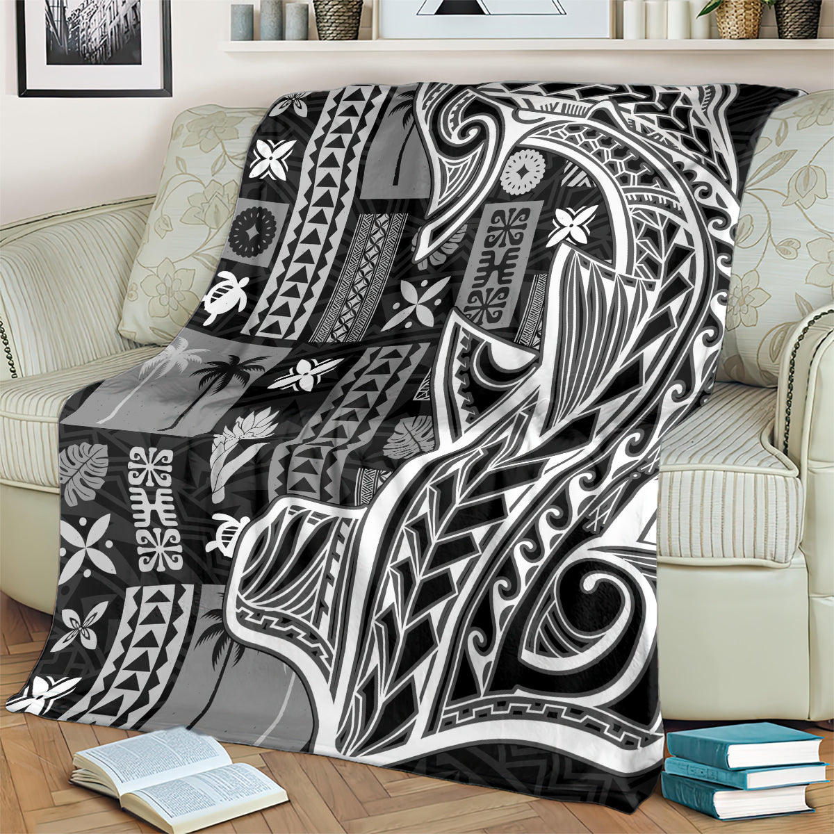 Samoan tapa-style throw blanket on armchair with black-and-white tribal tatau artwork