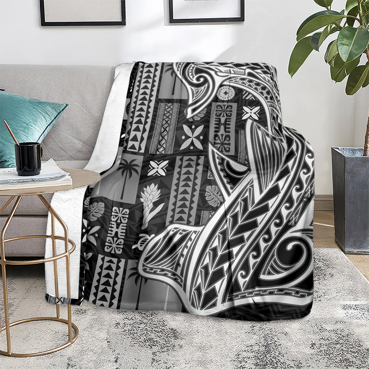 Samoan tapa-style throw blanket on floor rug, black-and-white tatau and tiki motifs