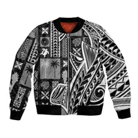 Black unisex bomber jacket with bold black-and-white tapa-style geometric patterns, front zip