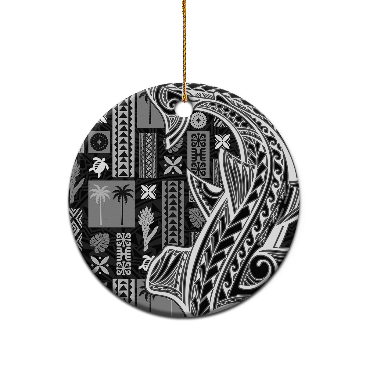 Round black and white tapa ceramic ornament with gold string on a plain background