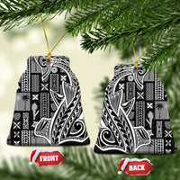 Bell-shaped black and white tapa ceramic ornament with gold string for hanging