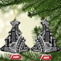 Pair of bell-shaped black and white tapa ceramic ornaments with gold hanging strings