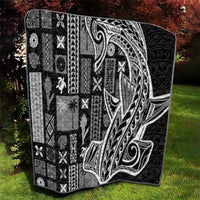 Black and white tapa quilt showing full Tatau-style face pattern with geometric patchwork