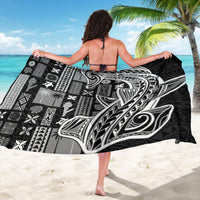 Black and white tapa sarong featuring large central bird motif with geometric blocks