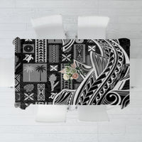 Black tapa patterned tablecloth with abstract tribal motifs, rectangular drape over table