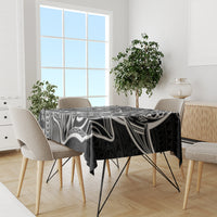 Black tapa-pattern tablecloth on dining table, black-and-white geometric motifs