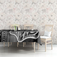 Black tapa-pattern tablecloth on dining table with chairs, white linework pattern