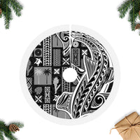 Black tapa tree skirt with white circular tapa motifs and textured white edge
