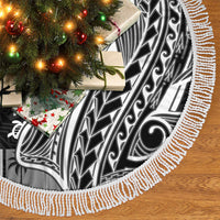 Black tapa tree skirt with white patterned border and long rope fringe edge