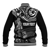 Black baseball jacket back with white Polynesian-style graphic, striped collar cuffs, snap front