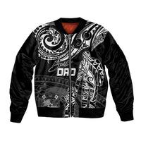 Black bomber jacket with white Polynesian tribal artwork and ribbed zip-front cuffs