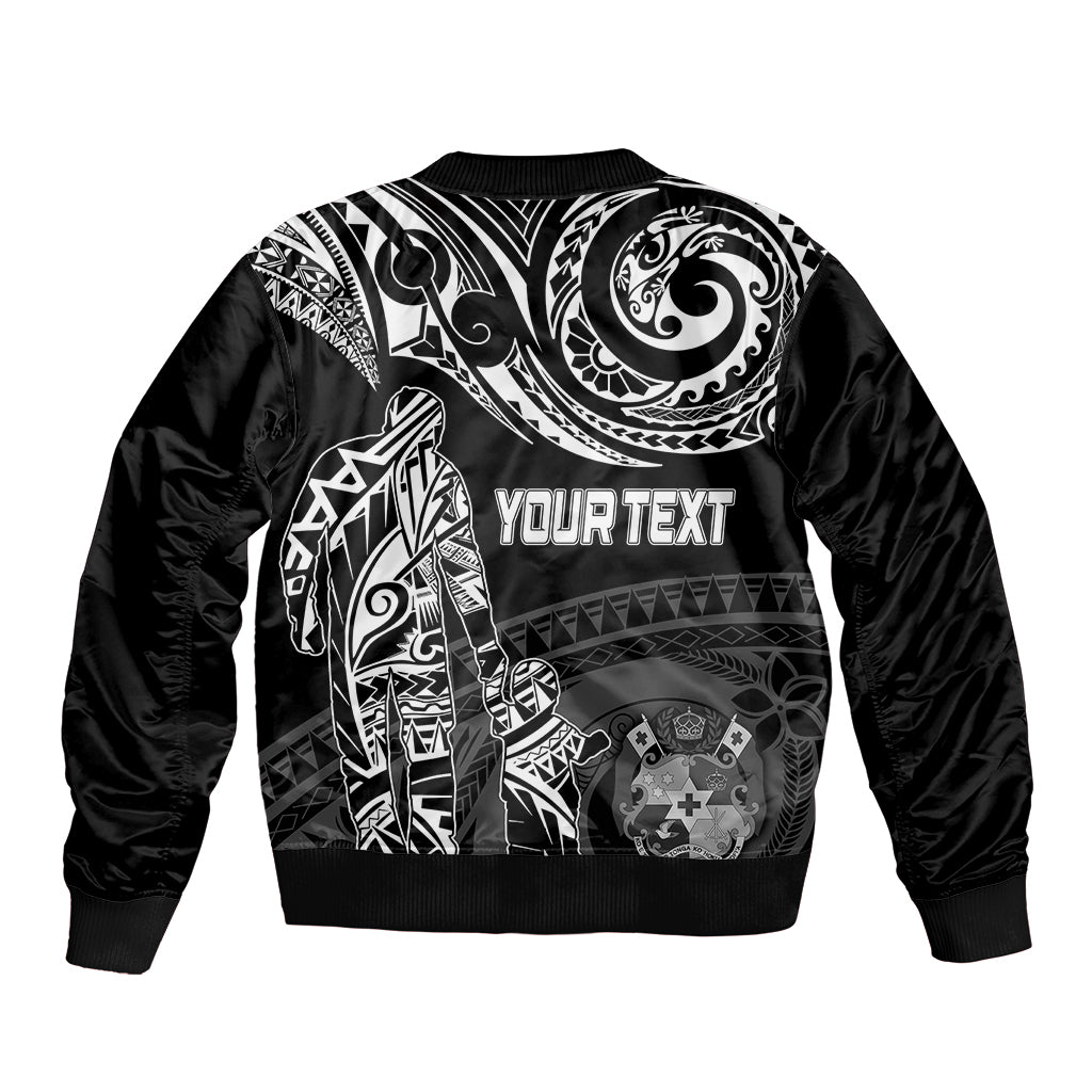 Black bomber jacket back with large white Polynesian design and 'YOURTEXT' across